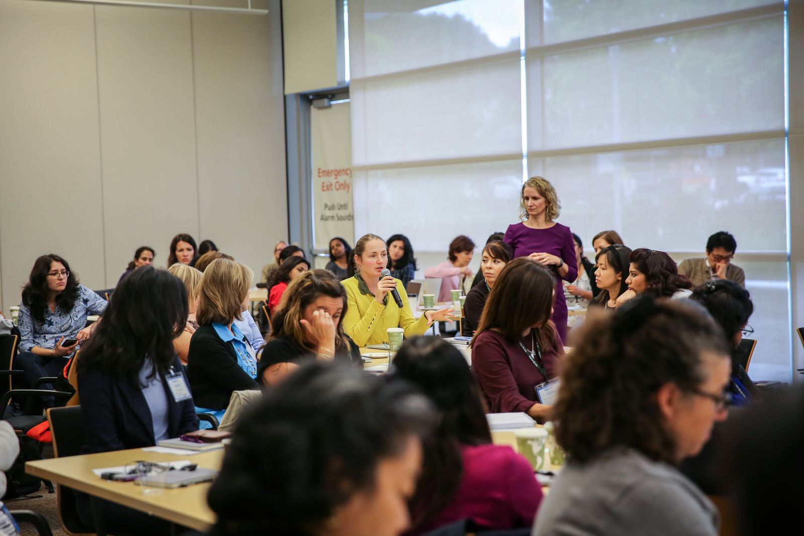 Returnship participants listen to alums during a workshop