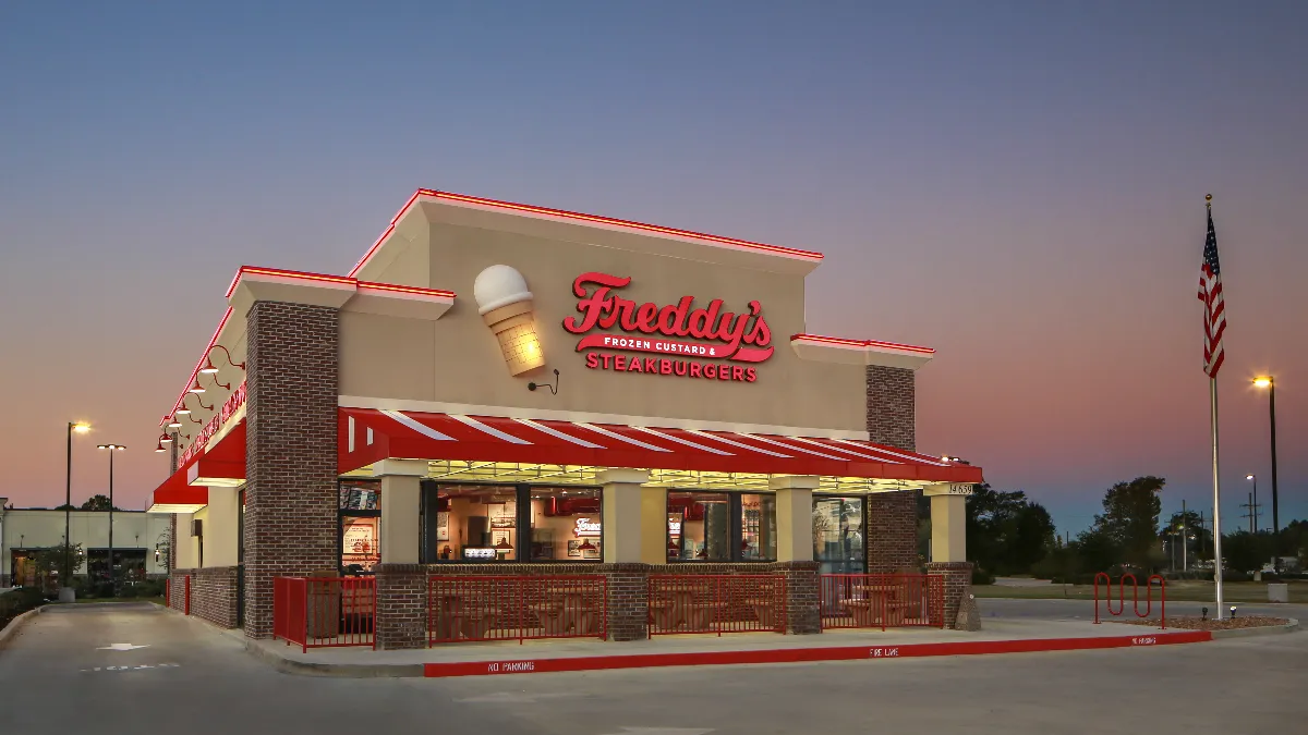 An image of a red and white building with Freddy's signage.