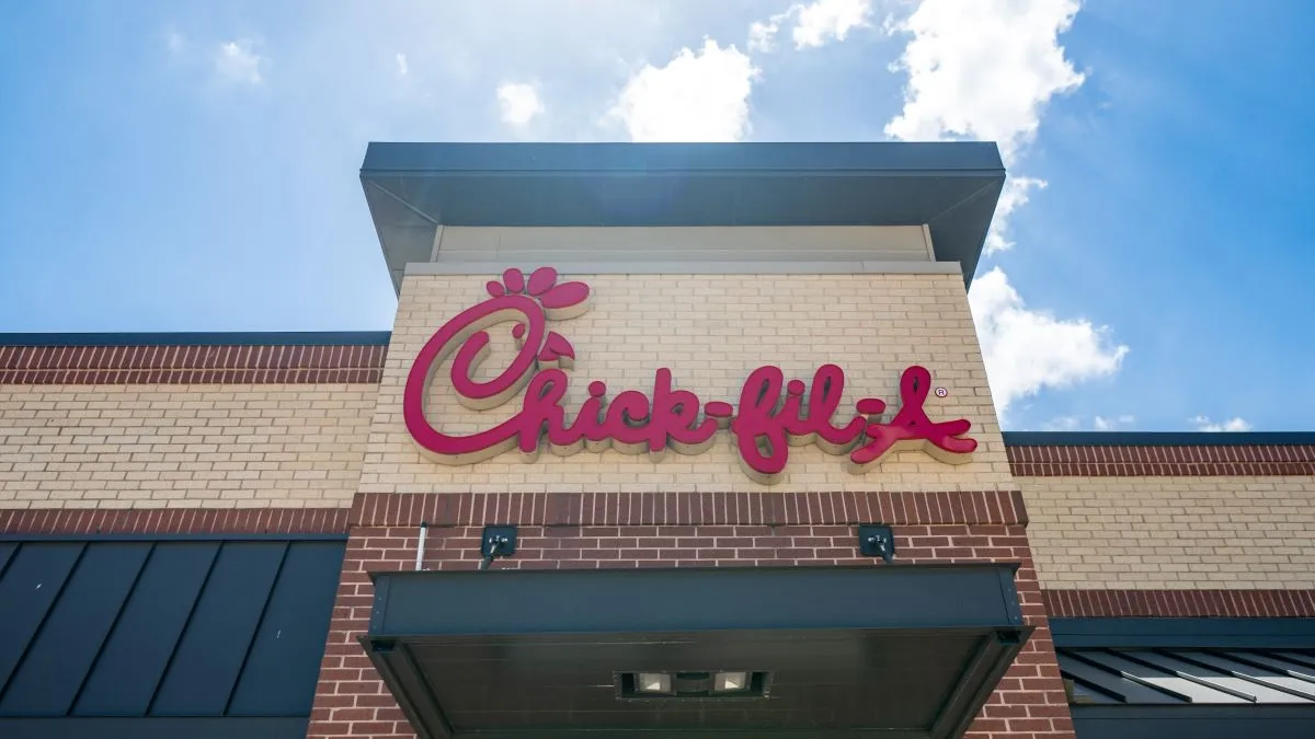 An image of a brick building with red Chick-fil-A signage