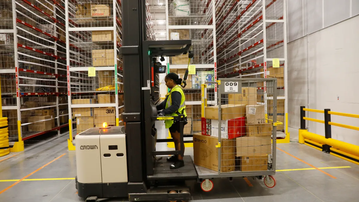 Amazon associates work to ship out same day orders during Cyber Monday at the Same-Day Delivery Facility Fulfillment Center on November 27, 2023 in Tampa, Florida.