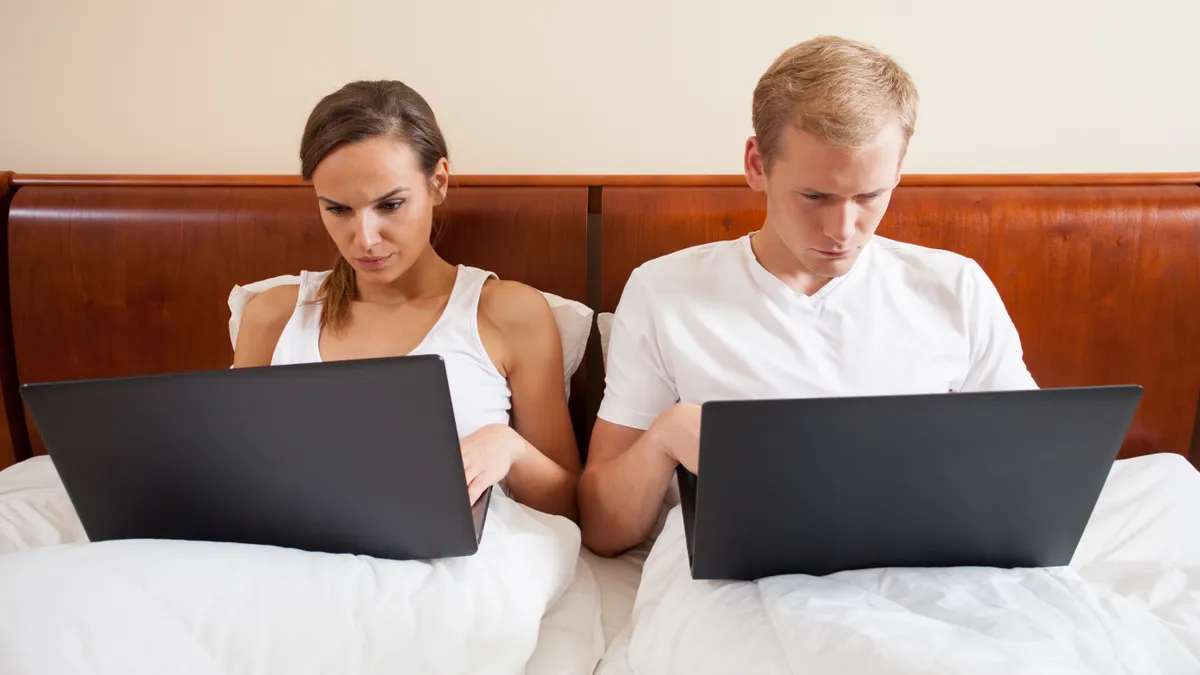 Horizontal view of marriage addicted to internet