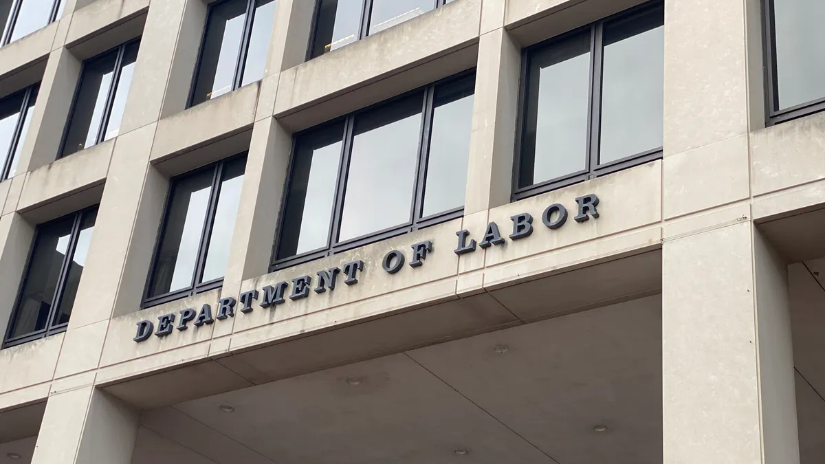 A close-up of the creamy exterior of the Department of Labor building.