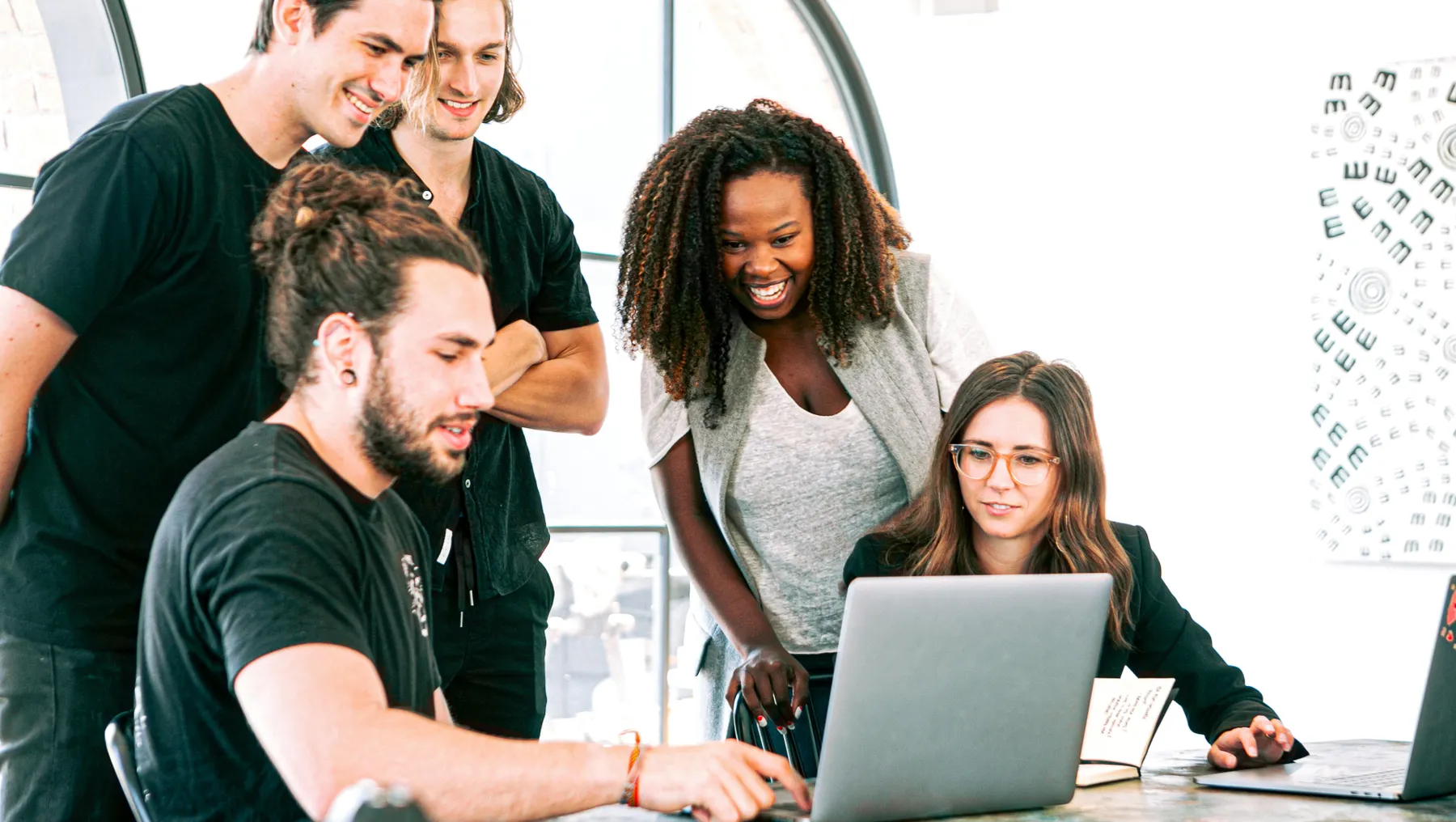 A multiethnic group of colleagues work together